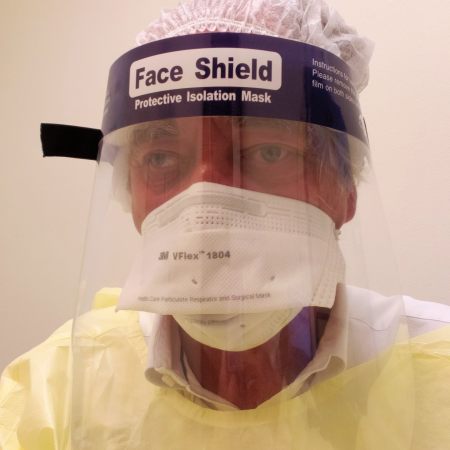 Photo Arthur Wernick PharmD in protective gear who was interviewed by the American Pharmacists Association for his work at True Blue Clinical Research.